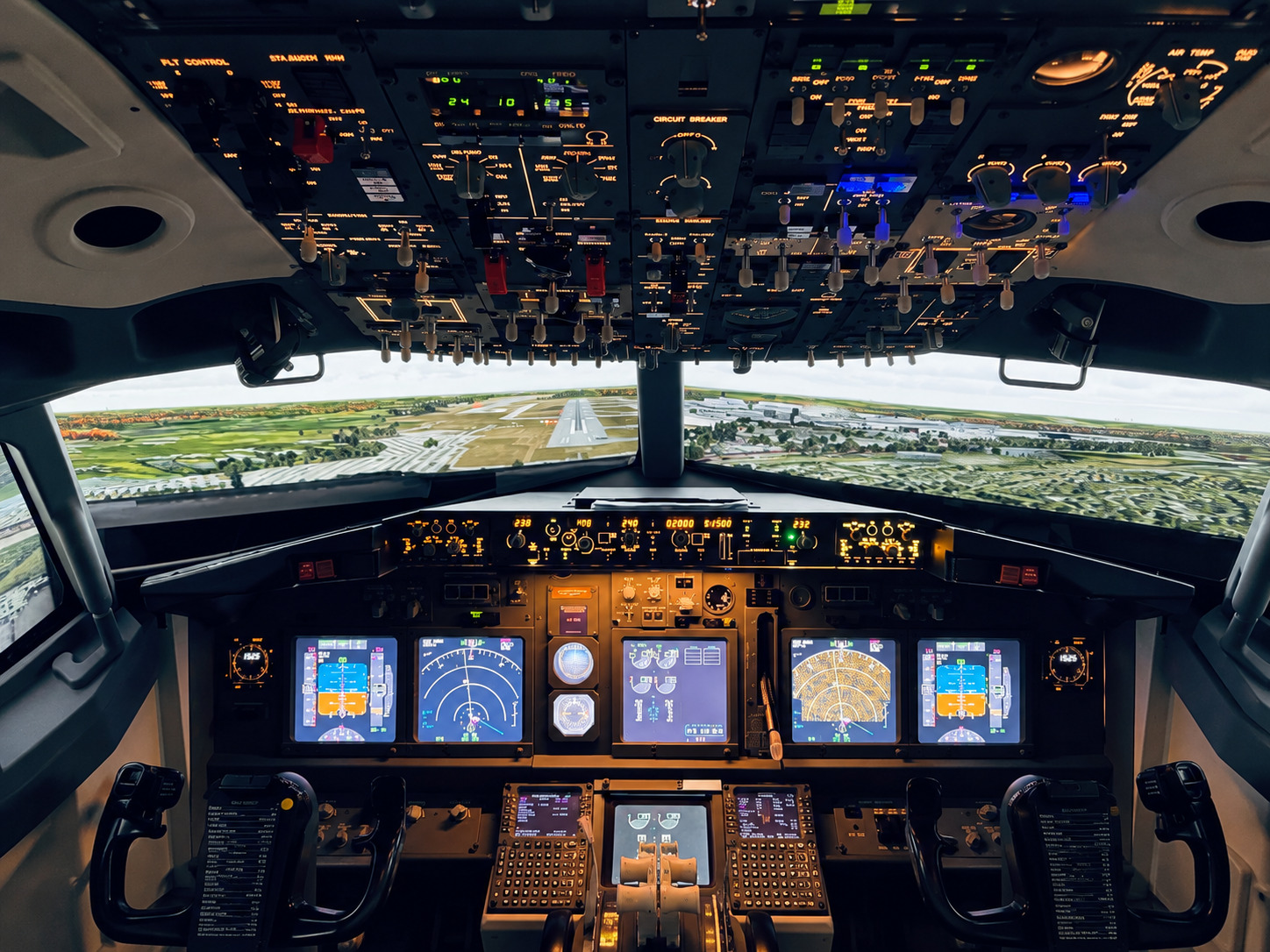 The Boeing 737-800 simulator, with two pilot seats, working controls and wrap-around screens