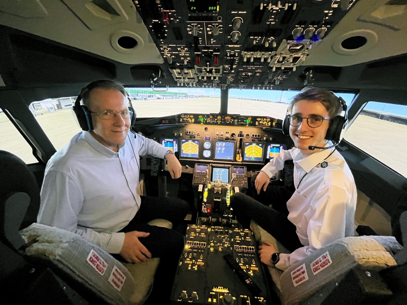 Jonathan and Harrison Grose at the controls of their Boeing 737 simulator
